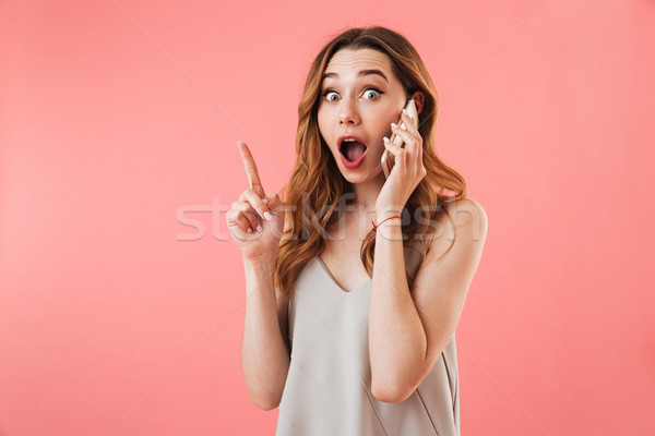 Megrémült barna hajú nő pizsama beszél okostelefon Stock fotó © deandrobot