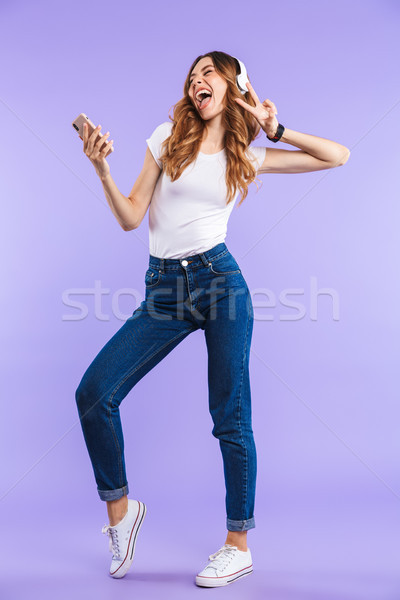 Portrait souriant jeune fille téléphone portable [[stock_photo]] © deandrobot