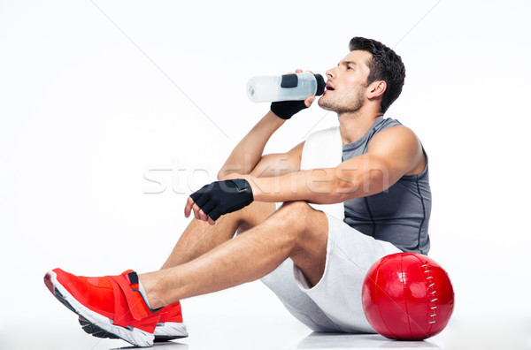 Stockfoto: Fitness · man · vergadering · vloer · drinkwater · geïsoleerd