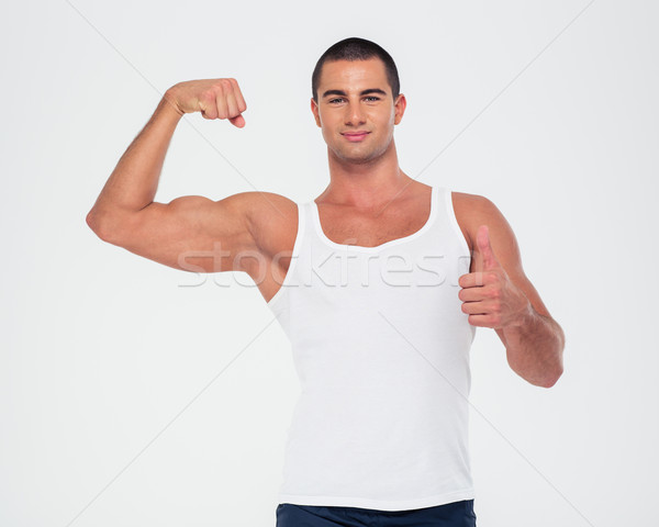 Stockfoto: Gelukkig · man · tonen · biceps · duim · omhoog