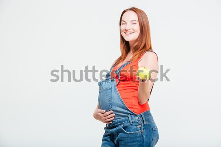 Pregnant woman eating apple  Stock photo © deandrobot