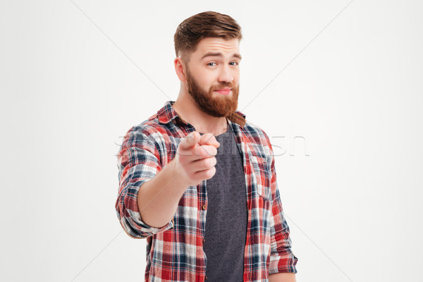 Mosolyog elégedett férfi kockás póló mutat Stock fotó © deandrobot