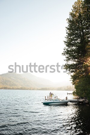 Man standing on his boat Stock photo © deandrobot