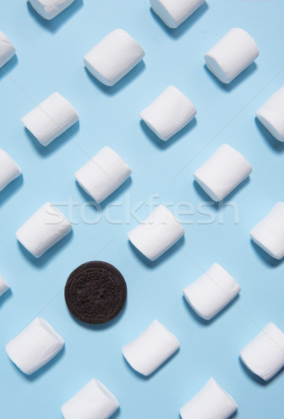 Sweeties marshmallows over blue table background. Stock photo © deandrobot