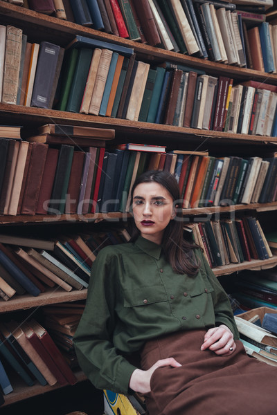 Portrait of girl in library looking camera Stock photo © deandrobot