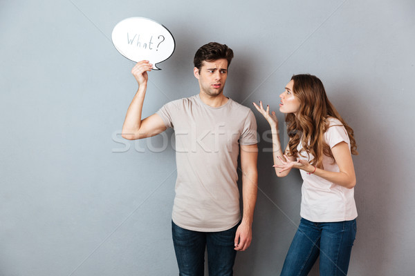 Portrait of a young couple having an argument Stock photo © deandrobot