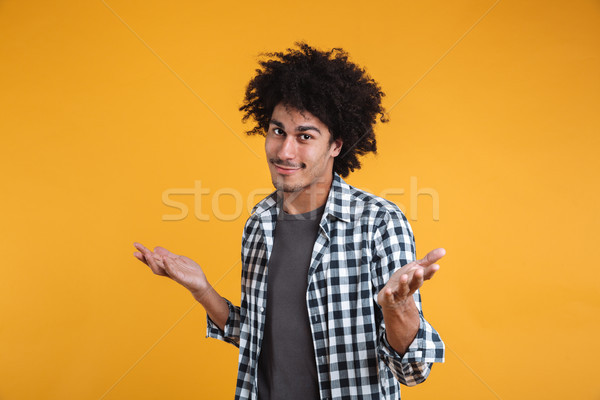 Portrait of an unconfident young afro american man Stock photo © deandrobot