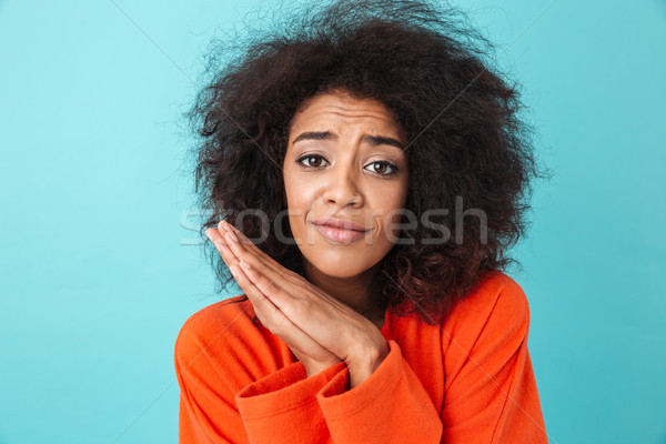 Cute american woman in colorful shirt with shaggy hair looking o Stock photo © deandrobot