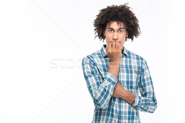 Portrait of a scared afro american man  Stock photo © deandrobot