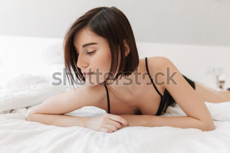 Nő fehérnemű ágy portré néz kamera Stock fotó © deandrobot
