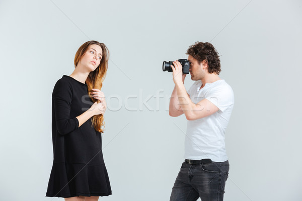 Man photographing female model  Stock photo © deandrobot