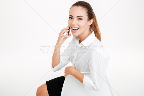 Stockfoto: Gelukkig · glimlachend · zakenvrouw · praten · mobiele · telefoon · vergadering