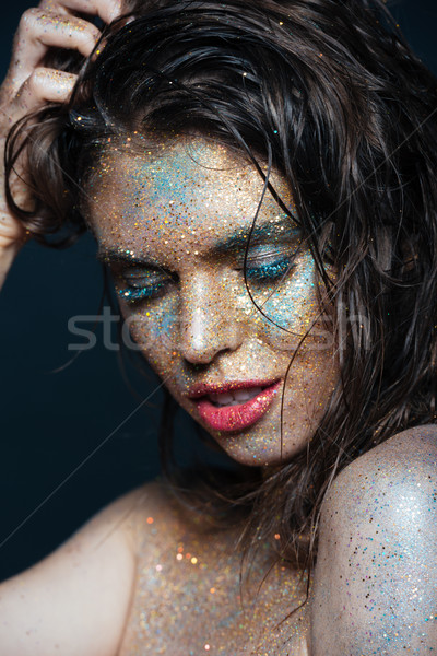 Beauty portrait of attractive young woman with glitter makeup Stock photo © deandrobot