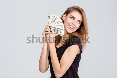 Pregnant cheerful woman holding ultrasound scans. Stock photo © deandrobot