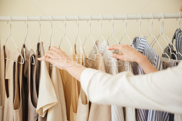 Close up of clothes hanging on rack Stock photo © deandrobot