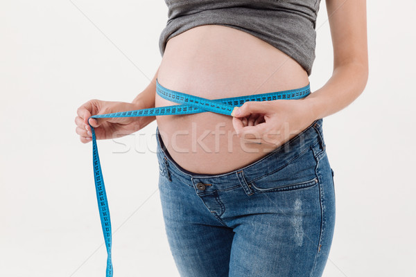Close up portrait of a pregnant woman belly Stock photo © deandrobot
