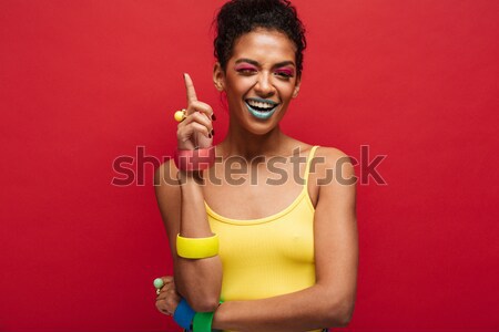 Multicolor image of young mulatto woman with trendy makeup looki Stock photo © deandrobot