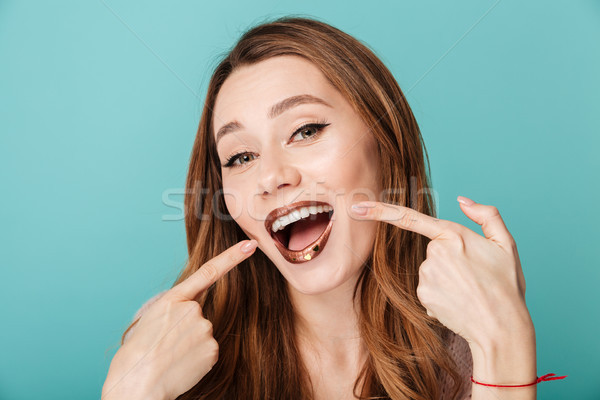 Portrait of a smiling brown haired woman Stock photo © deandrobot