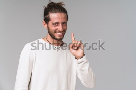 Close up portrait of a cheery young man in a white shirt Stock photo © deandrobot