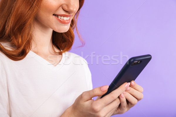 Stock photo: Close up of a smiling young girl standing