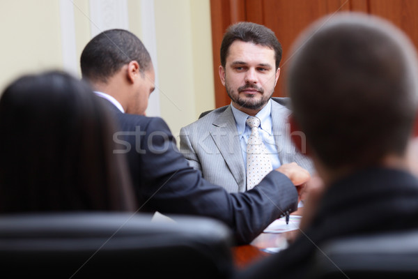 Mature businessman interviewing new people Stock photo © deandrobot