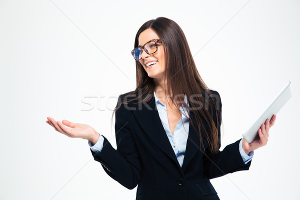 Woman holding tablet computer and shrugging Stock photo © deandrobot