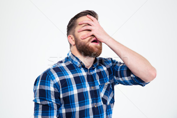 Man covering her face with hand  Stock photo © deandrobot