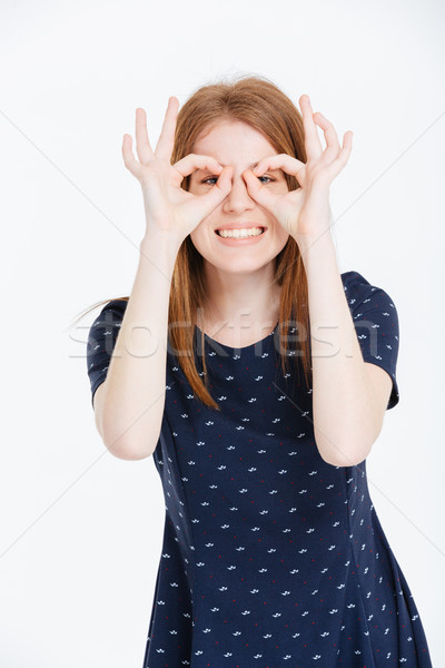 Mosolygó nő néz kamera ujjak mosolyog fiatal nő Stock fotó © deandrobot