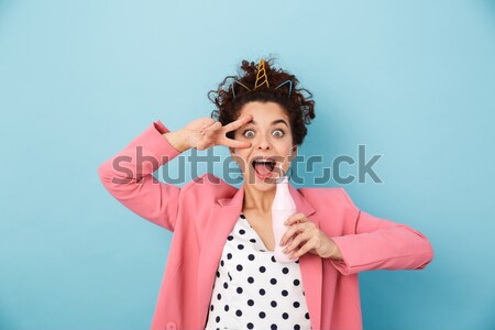 Funny angry woman with closed eyes covered ears by fingers  Stock photo © deandrobot