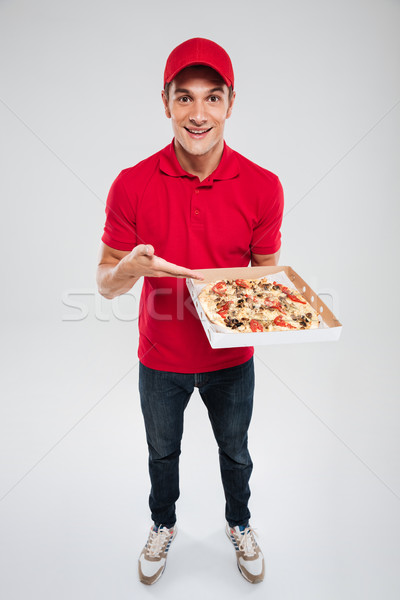 Pizza mensajero aislado gris mano Foto stock © deandrobot