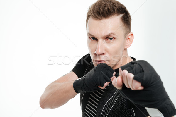 Close up portrait of a healthy fit sportsman boxing Stock photo © deandrobot