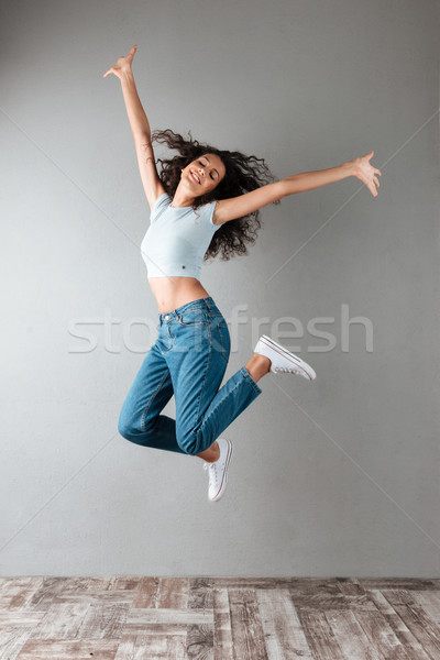 Funny kobieta skoki odizolowany radosny szczęśliwy Zdjęcia stock © deandrobot