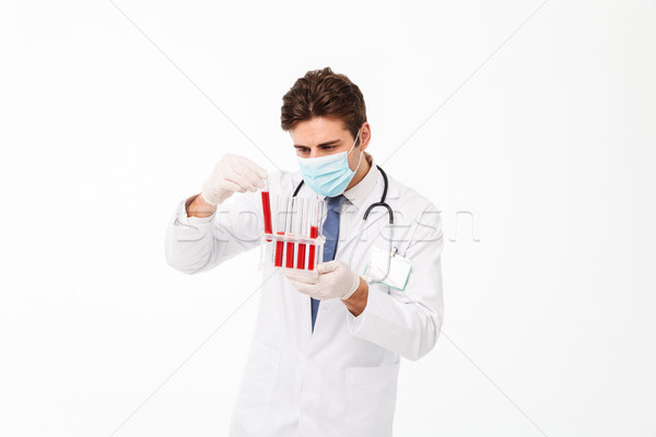 Close up portrait of a young male doctor Stock photo © deandrobot