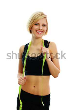 Young fit woman with measure tape Stock photo © deandrobot