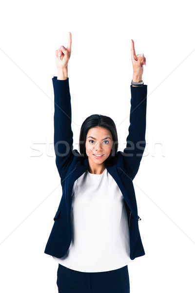 Happy businesswoman pointing fingers up Stock photo © deandrobot