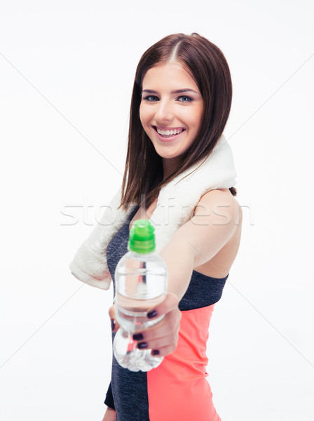 Happy fitness woman holding bottle of water Stock photo © deandrobot