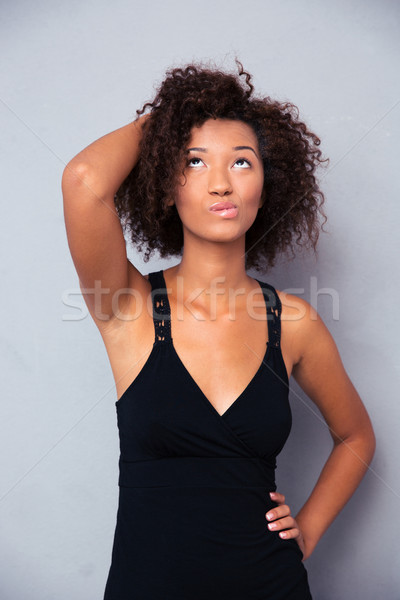Figyelmes afroamerikai nő felfelé néz portré szürke nő Stock fotó © deandrobot