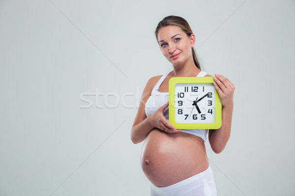 Femeie gravida perete ceas portret frumos Imagine de stoc © deandrobot