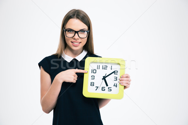 Woman pointing finger on big clock  Stock photo © deandrobot