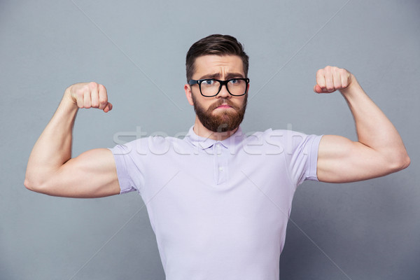 Stock fotó: Lezser · férfi · szemüveg · mutat · bicepsz · portré