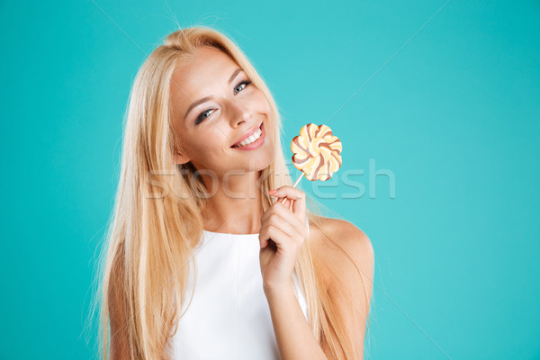 Gülen kadın lolipop bakıyor Stok fotoğraf © deandrobot