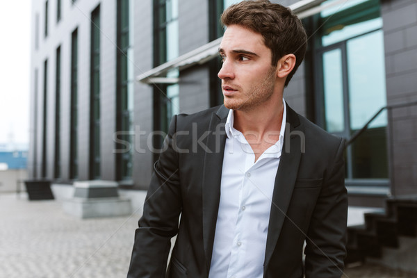 Surious business man outdoors Stock photo © deandrobot