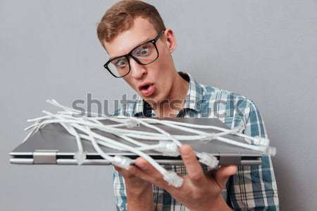 Hipster in glasses with laptop Stock photo © deandrobot
