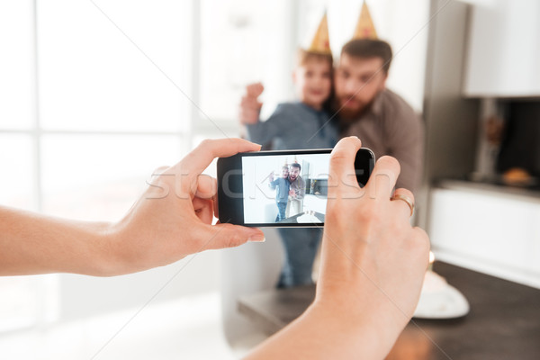 Bearded father in kitchen with birthday little son making selfie Stock photo © deandrobot