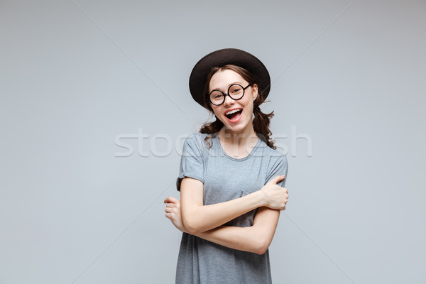 Boldog női stréber karok szemüveg fekete Stock fotó © deandrobot