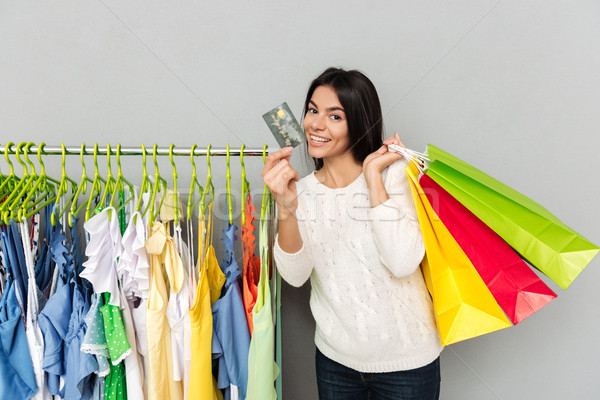 Woman shopping with credit card Stock photo © deandrobot