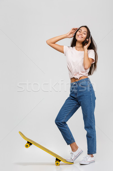 Portrait séduisant souriant asian femme casque [[stock_photo]] © deandrobot