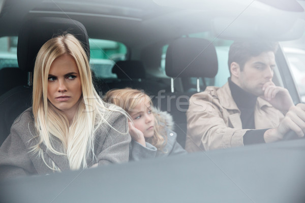 Angry displeased young family sitting in car after quarrel Stock photo © deandrobot