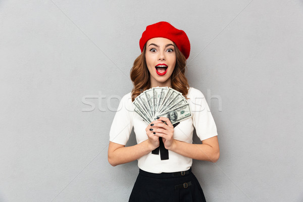Portrait of a joyful schoolgirl dressed in uniform Stock photo © deandrobot