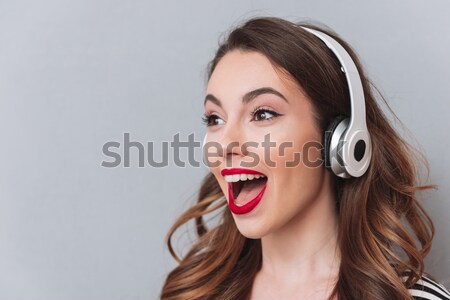 Stock photo: Portrait of a cheerful brown haired woman